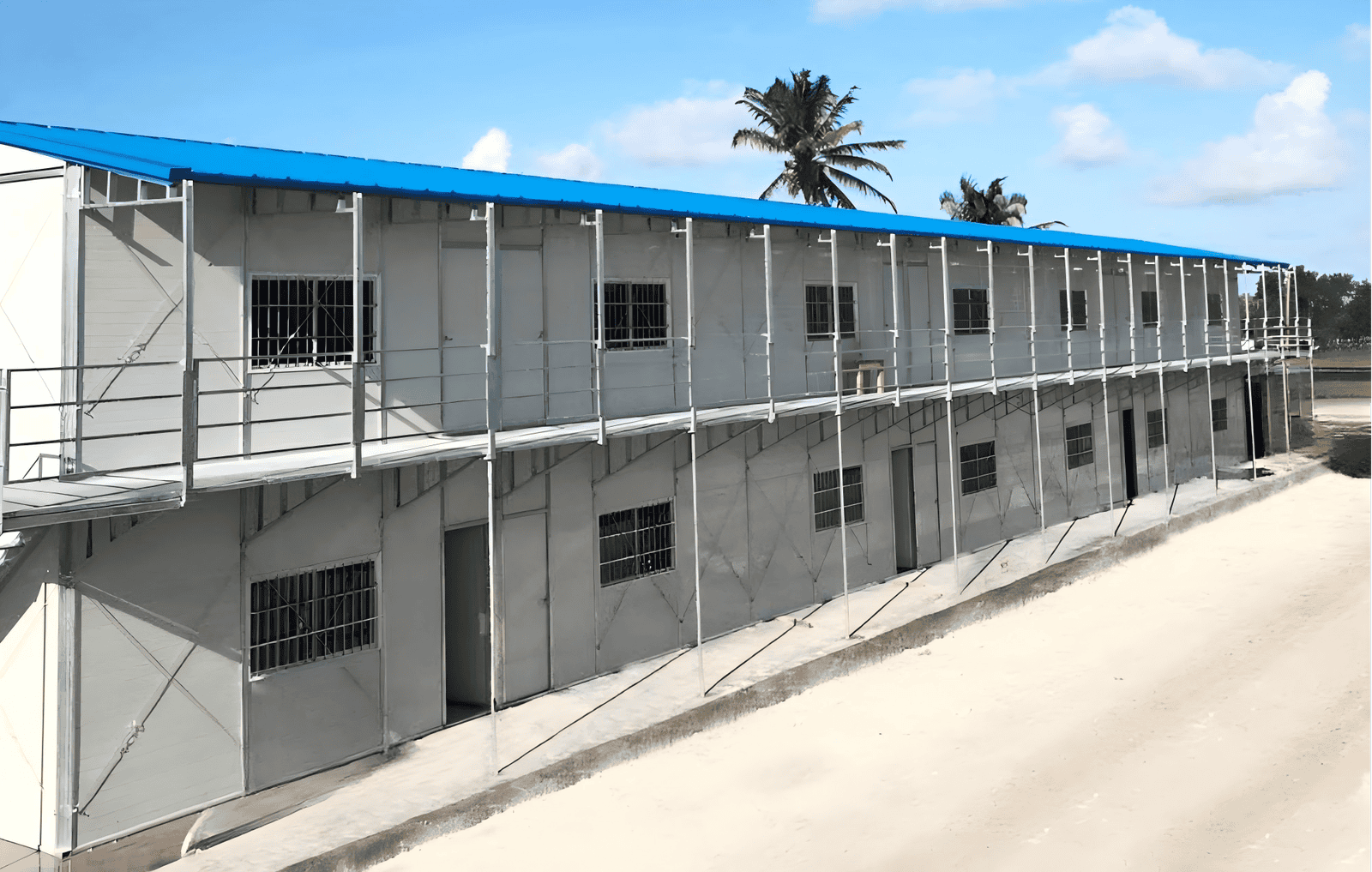 Pre-fabricated modular building with steel frame, construction scaffolding, and multiple windows, designed for flexible, efficient, and durable modular housing or commercial use in various locations.