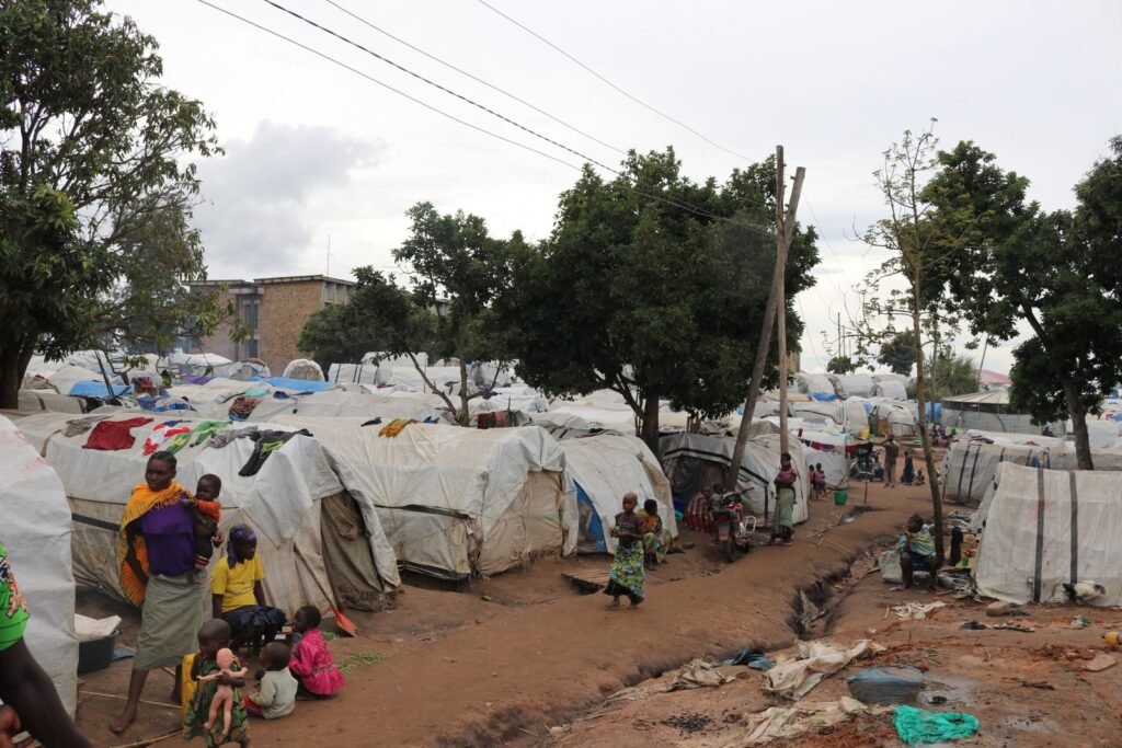 Humanitarian refugee camp in Africa showing temporary shelters for displaced communities