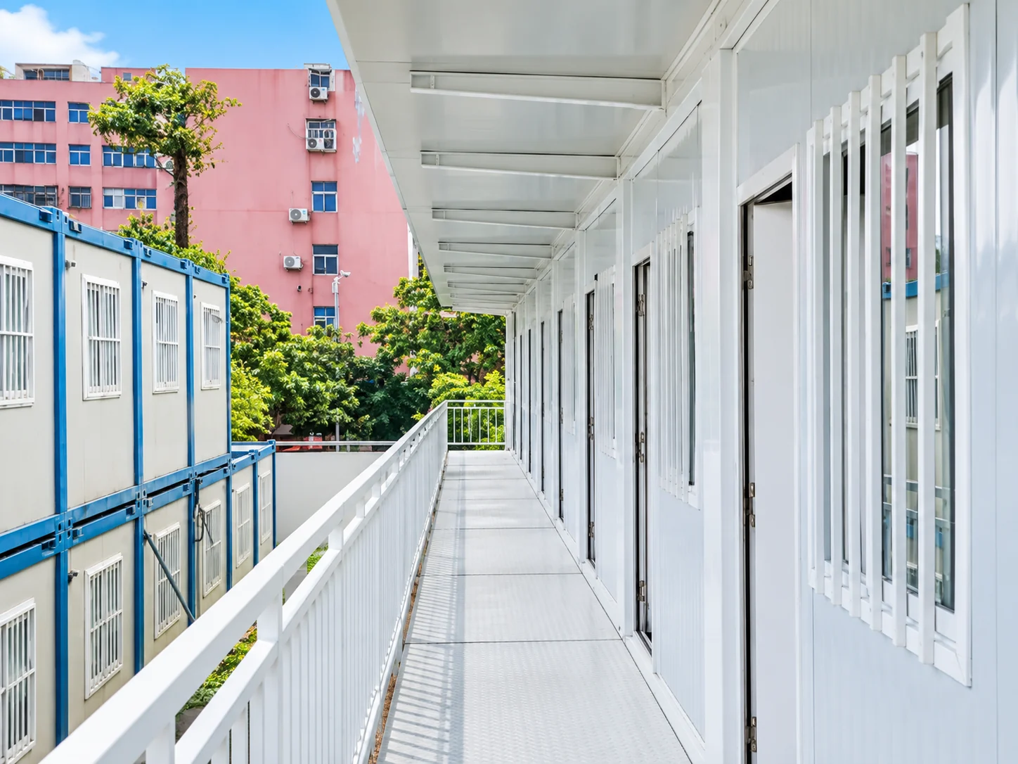 Two-storey flat-pack office zone with external stair, corridor and covered terrace