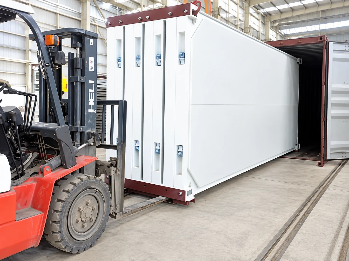 Flat-pack modules and project components loaded for transport to the 73-unit project site