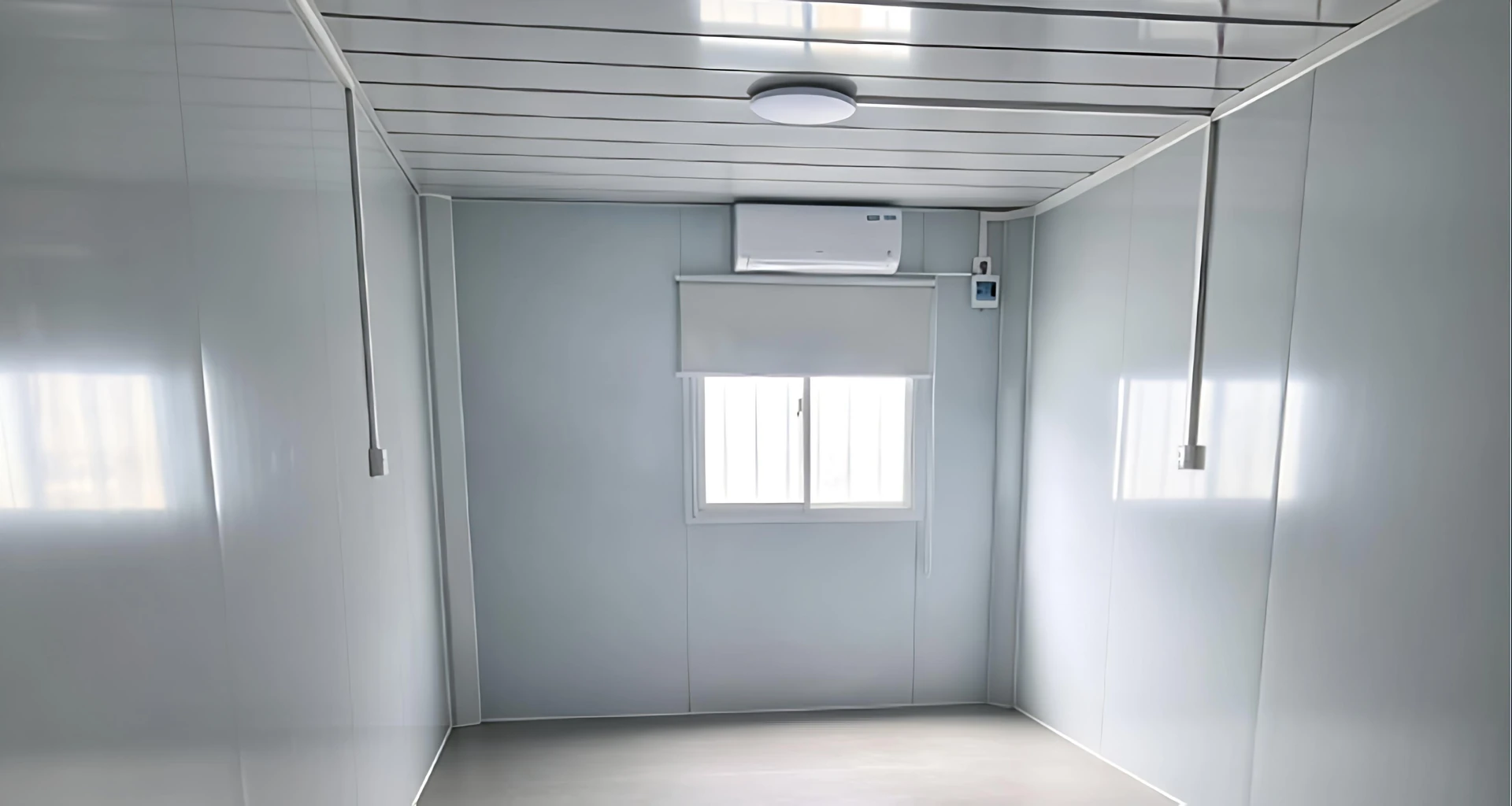 Interior display of a detachable container house with wall panels, window, floor and air-conditioning unit