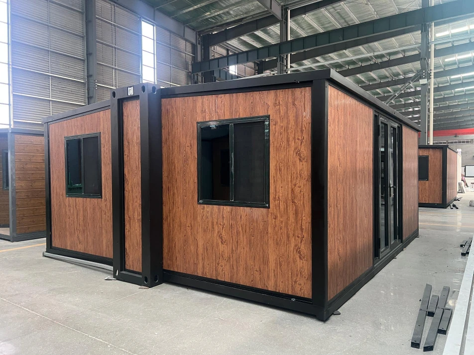 F720 compact double-wing expandable house with wood-effect cladding in the workshop