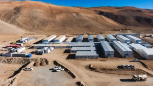 Aerial view of modular mining camp buildings in a remote mountainous area