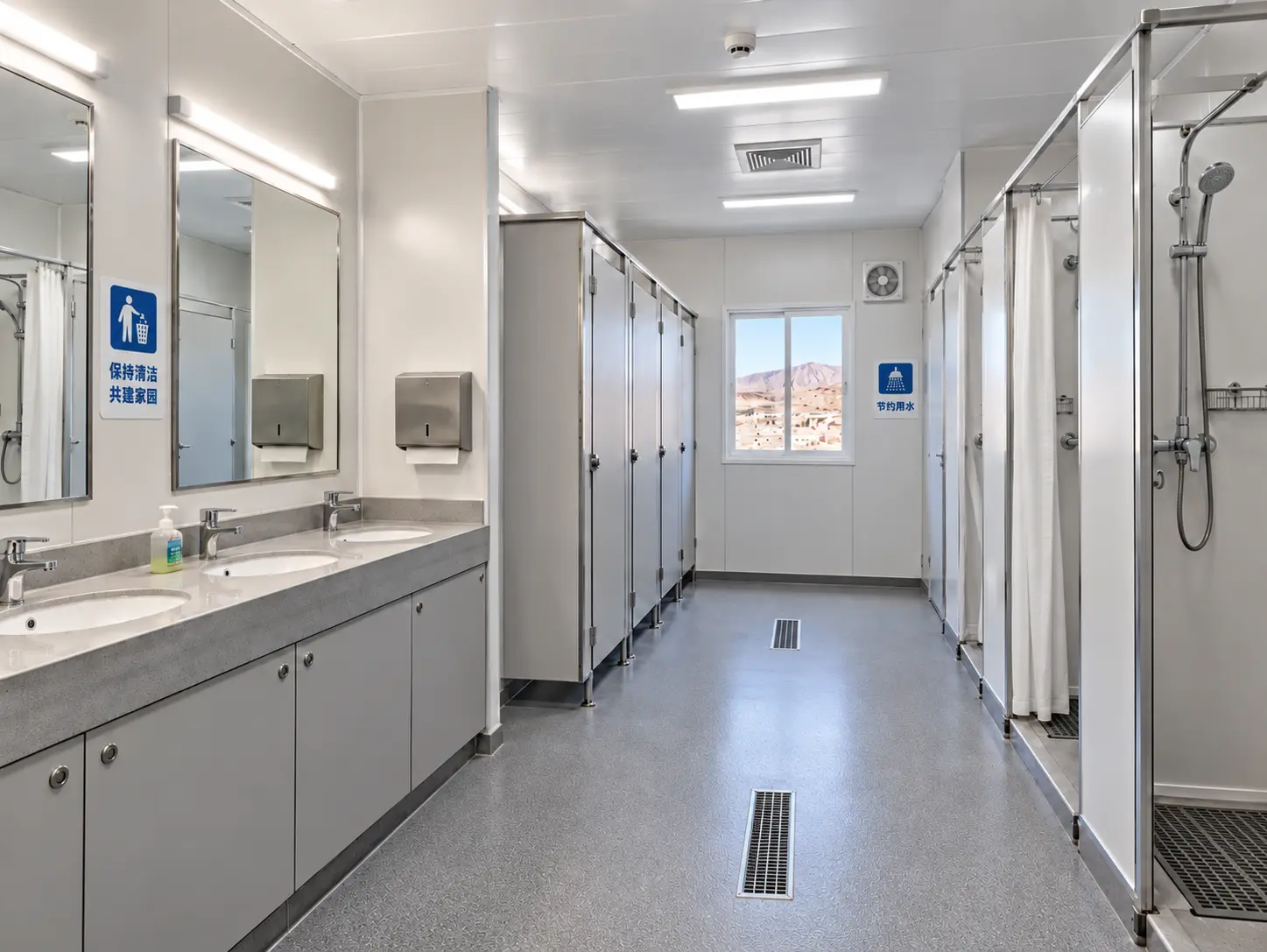 Shared shower and restroom facility with washbasins, toilet cubicles and shower stalls