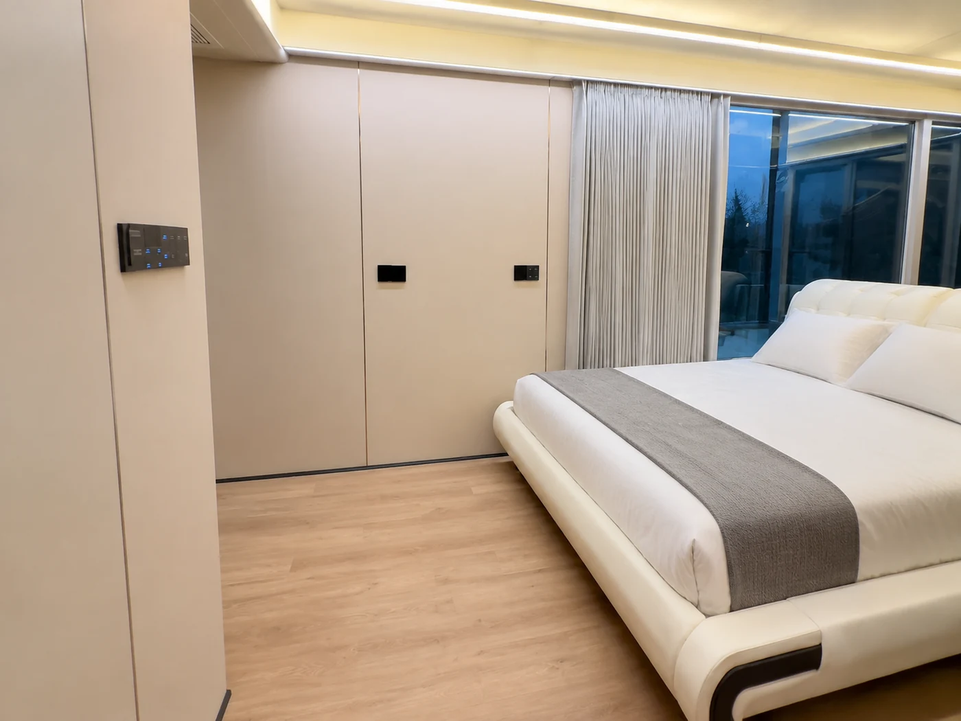 Space capsule bedroom fit-out example with a double bed, wardrobe and curtains