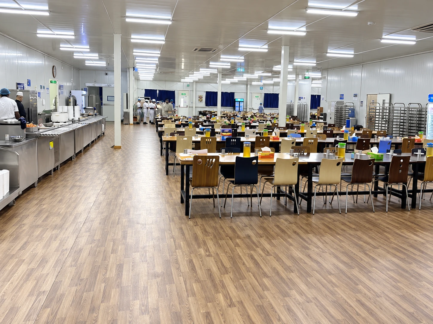 Configuration reference: Staff dining interior with tables, chairs and a food-service counter